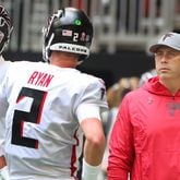 Falcons tight end Kyle Pitts (8), quarterback Matt Ryan (2) and head coach Arthur Smith gather on the sideline during 32-6 season opening loss to the Philadelphia Eagles Sunday, Sept. 12, 2021, at Mercedes-Benz Stadium in Atlanta. (Curtis Compton / Curtis.Compton@ajc.com)