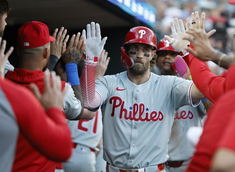 Philadelphia Phillies' Bryce Harper celebrates after hitting a three-run home run against the Detroit Tigers during the sixth inning of a baseball game Monday, June 24, 2024, in Detroit. (AP Photo/Duane Burleson)