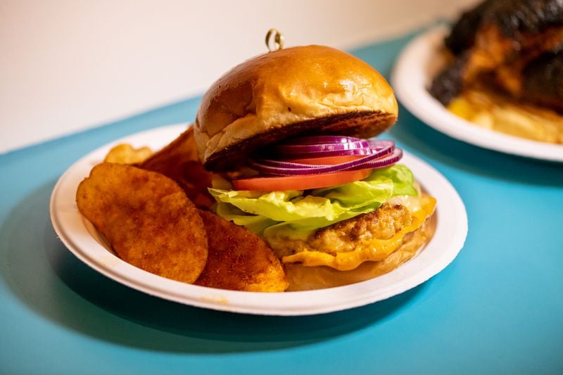 Though rotisserie chicken plates are the star at Nani’s Piri Piri Chicken, Nani's Chicken Burger is among the other popular features.  (Mia Yakel for The Atlanta Journal-Constitution)