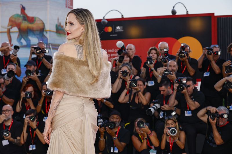 Angelina Jolie poses for photographers upon arrival for the premiere of the film 'Maria' during the 81st edition of the Venice Film Festival in Venice, Italy, on Thursday, Aug. 29, 2024. (Photo by Joel C Ryan/Invision/AP)