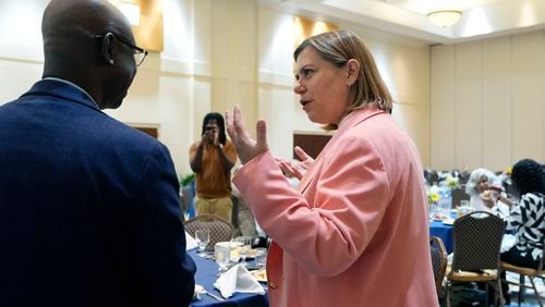 U.S. Senate candidate, Rep. Elissa Slotkin, D-Mich., talks with faith and community leaders at the Greater Grace Temple, Friday, Aug. 2, 2024, in Detroit. (AP Photo/Carlos Osorio)