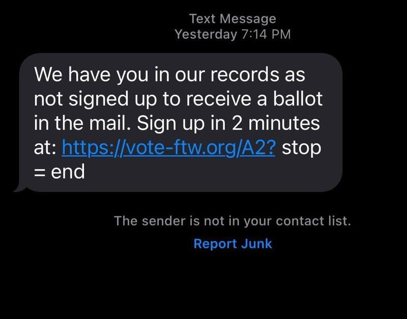 A screenshot of a spam text message circulating telling people to sign up to receive a ballot in the mail. (Taylor Croft/taylor.croft@ajc.com)