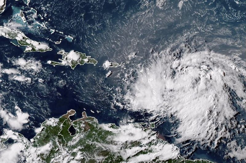 This GOES-16 GeoColor satellite image taken at 4:30 p.m. EDT and provided by National Oceanic and Atmospheric Administration (NOAA) shows Tropical Storm Ernesto over the Atlantic Ocean and moving westward toward the Lesser Antilles, Monday, Aug. 12, 2024. (NOAA via AP)