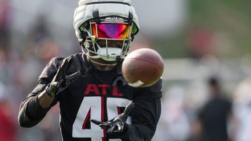 Atlanta Falcons linebacker Donavan Mutin (45) catches the ball during an NFL training camp football practice, Saturday, July 27, 2024, in Buford, Ga. (AP Photo/Jason Allen)