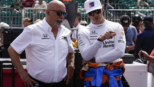 Graham Rahal, right, talks with his dad, Bobby Rahal, during qualifications for the Indianapolis 500 auto race at Indianapolis Motor Speedway, Saturday, May 18, 2024, in Indianapolis. (AP Photo/Darron Cummings)