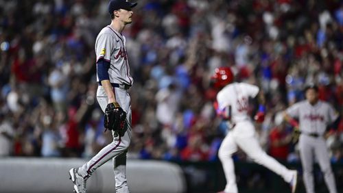 Atlanta Braves' Max Fried, left, walks off the mound after giving up a solo home run to Philadelphia Phillies' Edmundo Sosa during the third inning of a baseball game, Saturday, Aug. 31, 2024, in Philadelphia. The Braves lost 3-0. (AP Photo/Derik Hamilton)