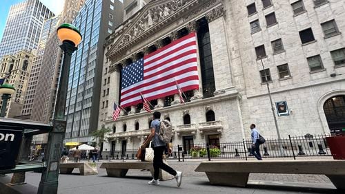 FILE - American flags hang on the front of the New York Stock Exchange on Sept. 11, 2024, in New York. (AP Photo/Peter Morgan, File)