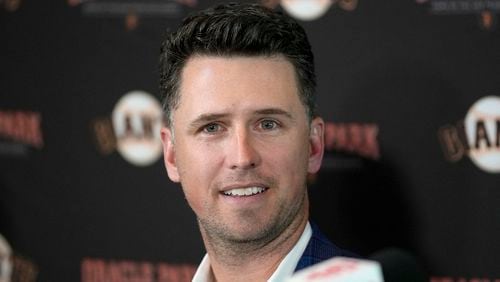 FILE - San Francisco Giants catcher Buster Posey talks during a news conference, Nov. 4, 2021, in San Francisco. (AP Photo/Tony Avelar, file)