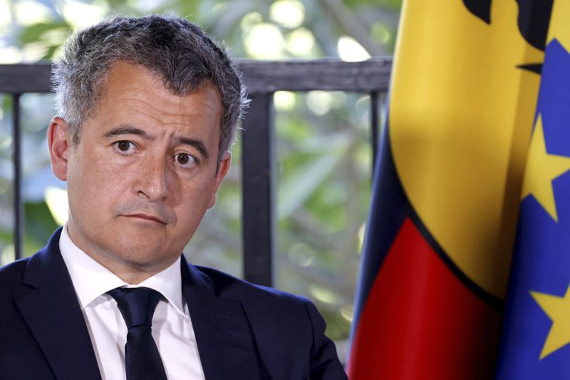 France's Minister for Interior and Overseas Gerald Darmanin attends a meeting with French President Emmanuel Macron, New Caledonia's elected officials and local representatives at the French High Commissioner Louis Le Franc's residence in Noumea,New Caledonia, Thursday, May 23, 2024. Macron has landed in riot-hit New Caledonia, having crossed the globe by plane from Paris in a high-profile show of support for the French Pacific archipelago wracked by deadly unrest and where indigenous people have long sought independence from France. (Ludovic Marin/Pool Photo via AP)