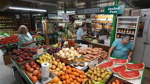 David Glenn and his mother, Judy Black (both behind the counter), run David’s Produce Market. The shop's future is uncertain because the property is up for sale. (Hyosub Shin/Hyosub.Shin@ajc.com)