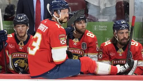 Florida Panthers center Sam Reinhart (13) sits on the bench with his teammates at the end of the third period of Game 5 of the NHL hockey Stanley Cup Finals against the Edmonton Oilers, Tuesday, June 18, 2024, in Sunrise, Fla. The Oilers defeated the Panthers 5-3. (AP Photo/Rebecca Blackwell)