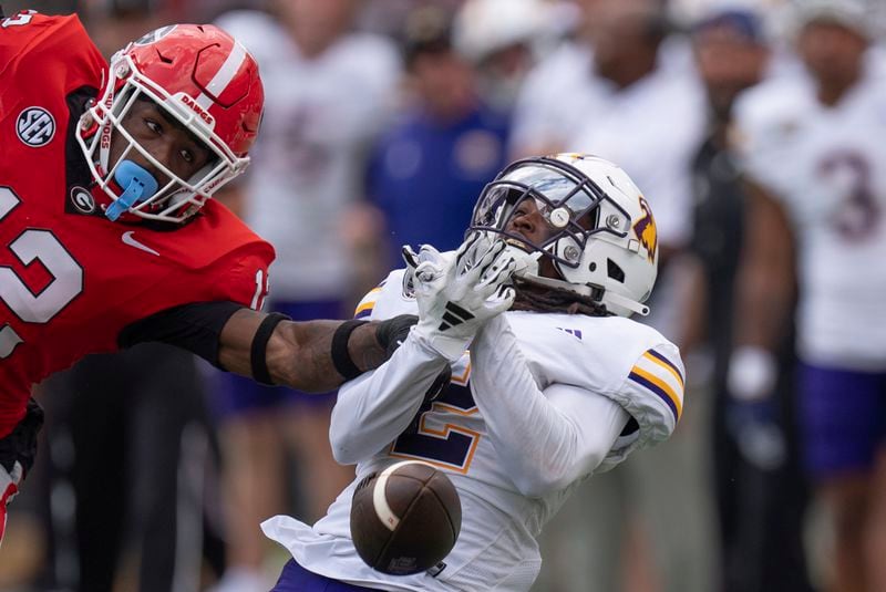 Georgia defensive back Julian Humphrey (12) breaks up a pass indented for Tennessee Tech wide receiver Tremel Jones (2) during the second half of an NCAA college football game Saturday, Sept. 7, 2024, in Athens, Ga. (AP Photo/John Bazemore)