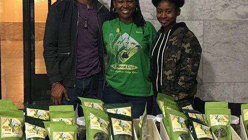 Valerie Burroughs (center) often can be found offering demos of Val’s Kale Chips, along with her daughter Adiah (right) and Brandon Thorpe (left).