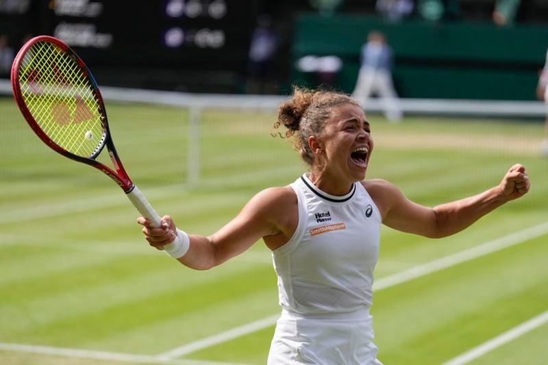 Jasmine Paolini of Italy celebrates after defeating Donna Vekic of Croatia in their semifinal match at the Wimbledon tennis championships in London, Thursday, July 11, 2024. (AP Photo/Mosa'ab Elshamy)