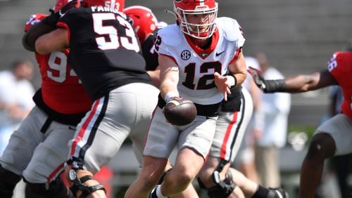 Georgia's quarterback Brock Vandagriff (12) makes a handoff during the G - Day game at Sanford Stadium, Saturday, April 15, 2023, in Athens. (Hyosub Shin / Hyosub.Shin@ajc.com) 