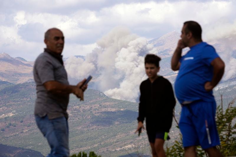 Smoke rises from Israeli shelling, seen from the southern Lebanese town of Marjayoun, Saturday, Sept. 21, 2024. (AP Photo/Hussein Malla)