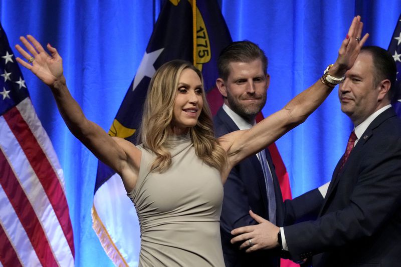 Lara Trump and her husband Eric Trump leave after speaking at the North Carolina GOP convention in Greensboro, N.C., Friday, May 24, 2024. (AP Photo/Chuck Burton)