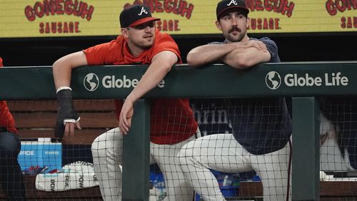 Atlanta Braves injured third baseman Austin Riley, left, and injured starting pitcher Spencer Strider watch from the dugout during a baseball game against the Toronto Blue JaysFriday, Sept. 6, 2024, in Atlanta. (AP Photo/John Bazemore)