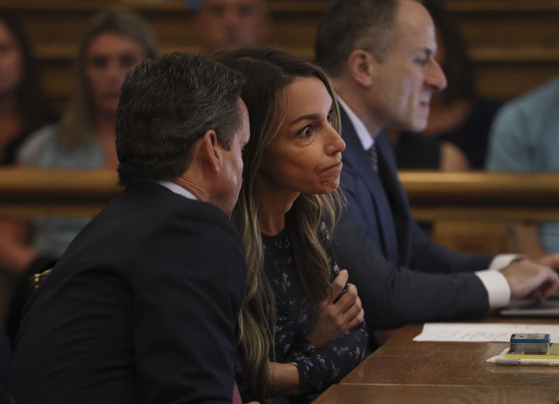 Karen Read listens to her attorney, Alan Jackson, during closing arguments in her trial at Norfolk Superior Court on Tuesday, June 25, 2024 in Dedham, Mass. Read is accused of killing her boyfriend Boston police Officer John O'Keefe, in 2022. (Nancy Lane/The Boston Herald via AP, Pool)