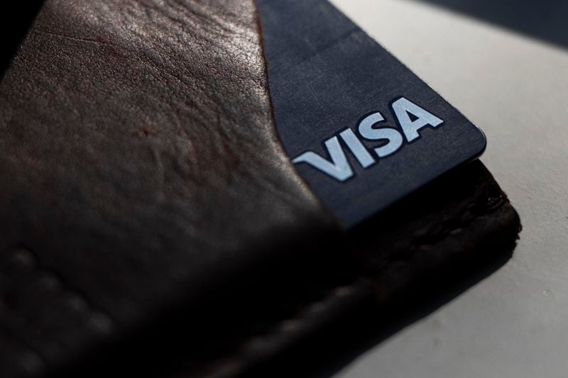 FILE - A Visa card is displayed on May 15, 2024, in Portland, Ore. (AP Photo/Jenny Kane, File)