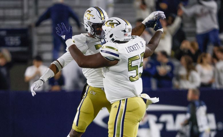 Georgia Tech Yellow Jackets defensive lineman Horace Lockett (55) and linebacker Trenilyas Tatum (7) celebrate a fourth down stop during the second half of an NCAA college football game between Georgia Tech and Syracuse in Atlanta on Saturday, Nov. 18, 2023.  Georgia Tech won, 31 - 22. (Bob Andres for the Atlanta Journal Constitution)