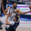 FILE - Minnesota Timberwolves center Karl-Anthony Towns (32) drives to the basket over Dallas Mavericks forward Maxi Kleber (42) during the second half in Game 4 of the NBA basketball Western Conference finals, Tuesday, May 28, 2024, in Dallas. (AP Photo/Gareth Patterson, File)