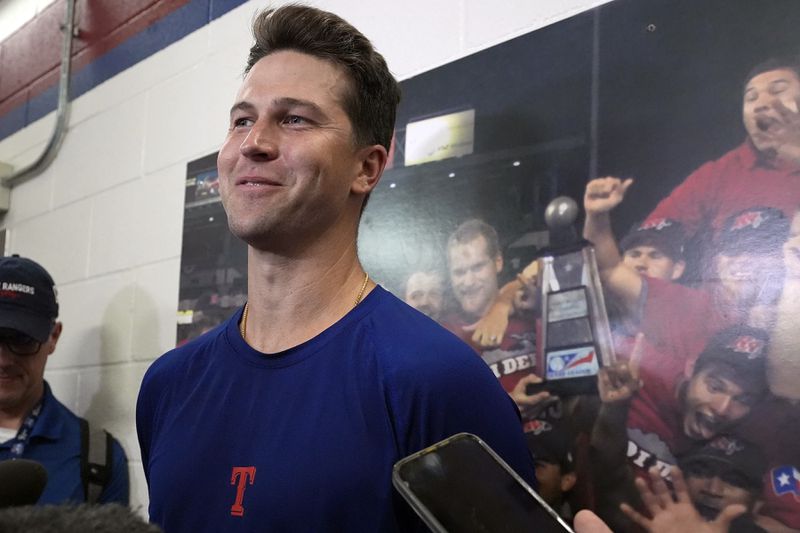 Texas Rangers pitcher Jacob deGrom smiles while taking questions from reporter after his rehab start in a Frisco Rough Riders baseball game in Frisco, Texas, Thursday, Aug. 22, 2024, (AP Photo/LM Otero)