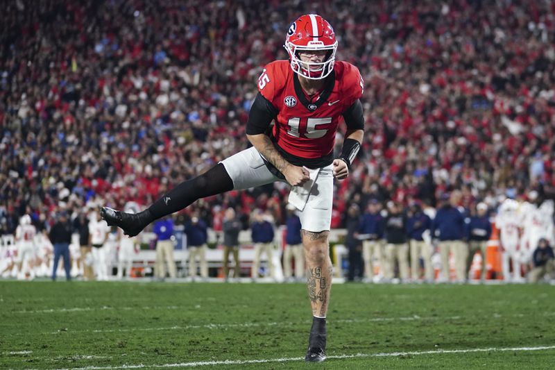 FILE - Georgia quarterback Carson Beck (15) reacts after a touchdown against Mississippi during the first half of an NCAA college football game, Saturday, Nov. 11, 2023, in Athens, Ga. (AP Photo/John Bazemore, File)