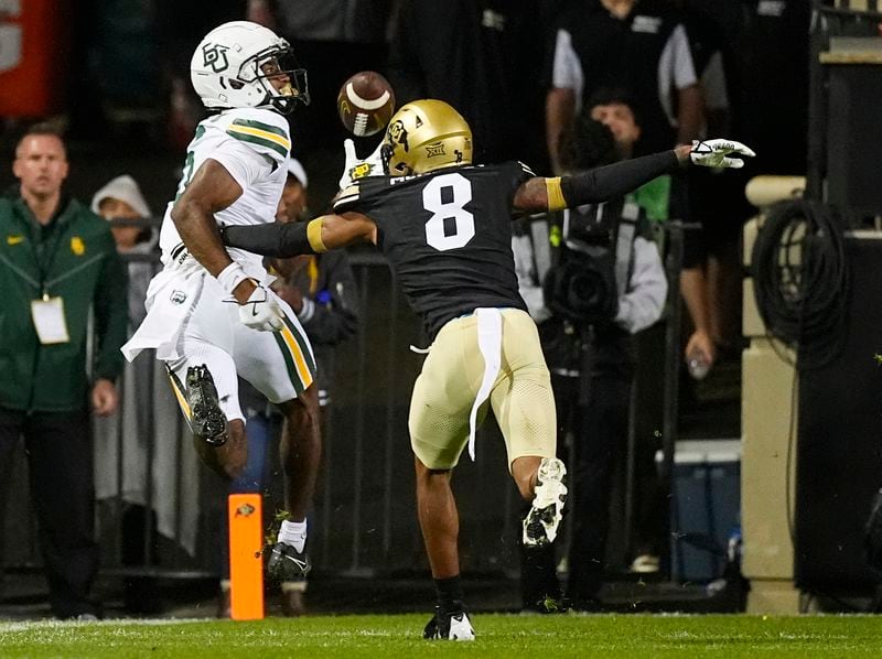 Baylor wide receiver Hal Presley, left, pulls in a touchdown pass over Colorado cornerback DJ McKinney in the second half of an NCAA college football game Saturday, Sept. 21, 2024, in Boulder, Colo. (AP Photo/David Zalubowski)