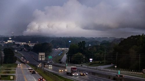 A large plume sits in the sky above Conyers on Monday Sept. 30, 2024 as I-20 reopened following the evacuation of about 17,000 people. Several metro Atlanta counties reported a haze and chemical smell Monday morning. A shelter-in-place order for all of Rockdale County has been extended indefinitely Monday. (John Spink/AJC)