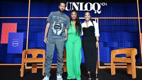 Cam Kirk (from left), Tenika B and Zeny Shifferaw pose on stage at UNLOQ404, An Inaugural Creators Summit In Atlanta presented by UTA at Overtime Elite Arena on October 14, 2023, in Atlanta. (Photo by Derek White/Getty Images for UTA)