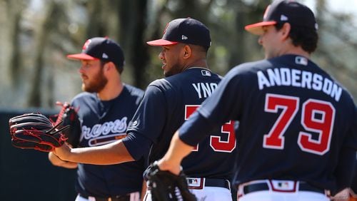 Braves pitchers Thomas Burrows (from left), Huascar Ynoa, and Ian Anderson get some work in the bullpen Sunday, Feb. 17, 2019, at the ESPN Wide World of Sports Complex in Lake Buena Vista, Fla.