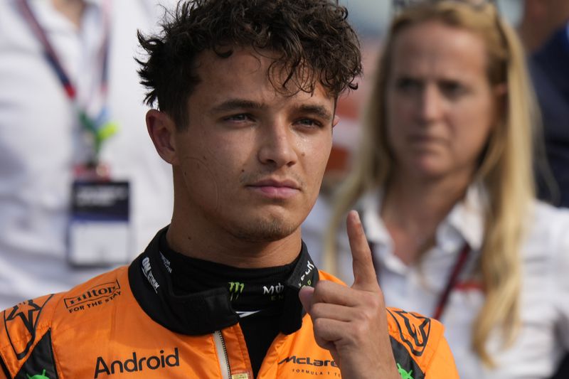 McLaren driver Lando Norris of Britain celebrates his pole position after qualifying session ahead of the Formula One Italian Grand Prix race at the Monza racetrack, in Monza, Italy, Saturday, Aug. 31, 2024. (AP Photo/Luca Bruno)