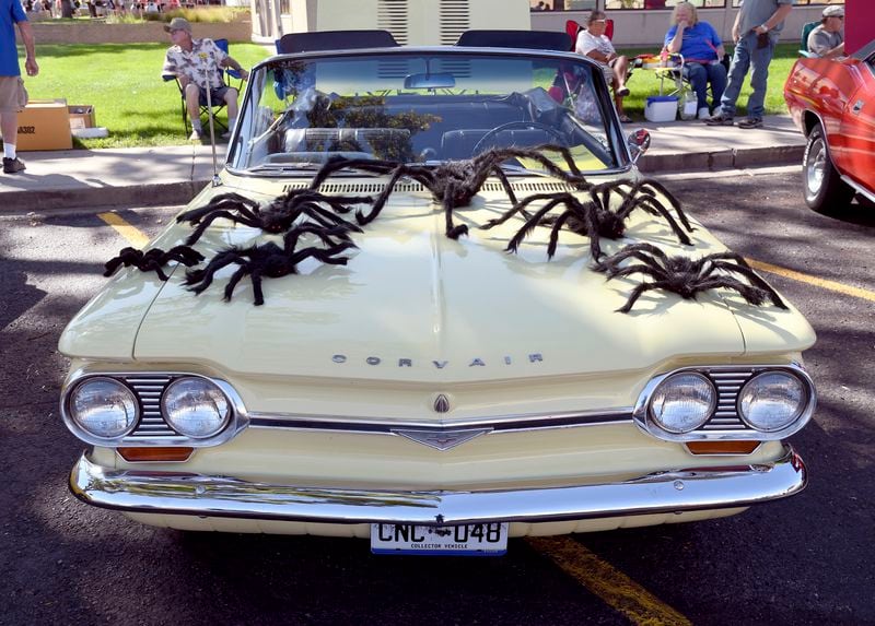 A classic car is decorated with fake spiders at the Tarantula Festival in La Junta, Colo., Saturday, Sept. 28, 2024. (AP Photo/Thomas Peipert)