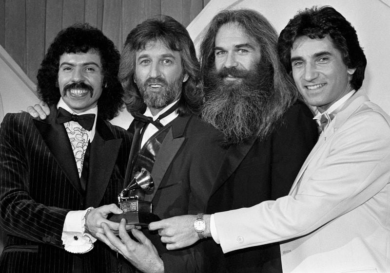 FILE - The Oak Ridge Boys, from left, Joe Bonsall, Duane Allen, William Lee Golden and Richard Sterban appear at the Grammy Awards with their their award for Country Performance by a duo or group in Los Angeles, Calif., Feb. 24, 1982. Bonsall died on Tuesday, July 9, 2024, from complications of Amyotrophic Lateral Sclerosis in Hendersonville, Tenn. He was 76. (AP Photo/Reed Saxon, File)