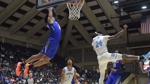 March 9, 2019 Macon - McEachern Isaac Okoro (35) ducks the ball against Meadowcreek in GHSA State Basketball Championship game at the Macon Centreplex in Macon on Saturday, March 9, 2019. McEachern won 62-54 over the Meadowcreek. HYOSUB SHIN / HSHIN@AJC.COM