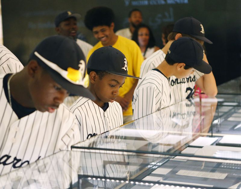 CHECKING THEIR HISTORY--June 23, 2015 - Jahli Hendricks (from left), Nasir Jackson and Jack Rice, members of a little league team based in Philadelphia, look over some of the King papers at the National Center for Civil and Human Rights. BOB ANDRES / BANDRES@AJC.COM