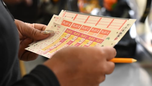 A customer chooses which numbers to play in Georgia's Powerball game.