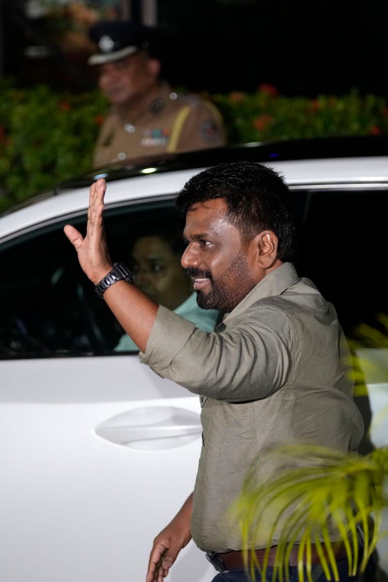 Marxist lawmaker Anura Kumara Dissanayake waves as he arrives at the election commission office after winning Sri Lankan presidential election, in Colombo, Sri Lanka, Sunday, Sept. 22, 2024. (AP Photo/Eranga Jayawardane)