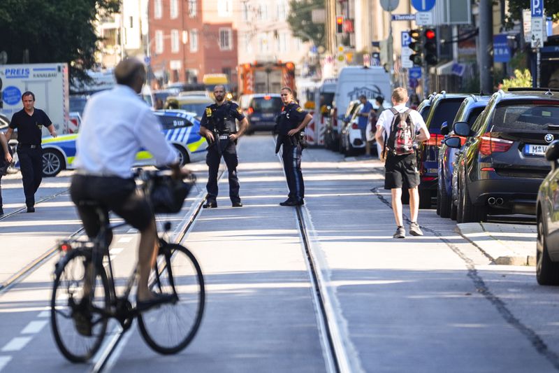 Police officers block a street after police fired shots at a suspicious person near the Israeli Consulate and a museum on the city's Nazi-era history in Munich, Germany, Thursday, Sept. 5, 2024. (AP Photo/Matthias Schrader)