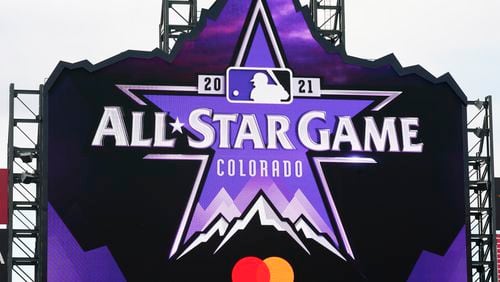 The logo for the 2021 Major League Baseball All-Star Game is revealed on the scoreboard before a  game between the Philadelphia Phillies and the Colorado Rockies on Friday, April 23, 2021, in Denver. (AP Photo/David Zalubowski)