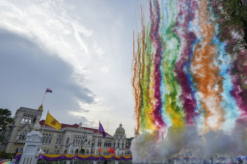 Fireworks shoot up in to sky at government house in Bangkok, Thailand, Tuesday, June 18, 2024. Thailand’s Senate voted overwhelmingly on Tuesday to approve a bill that would legalize same-sex marriage, clearing the last legislative hurdle for the country to become the first in Southeast Asia to enact such a law. (AP Photo/Sakchai Lalit)