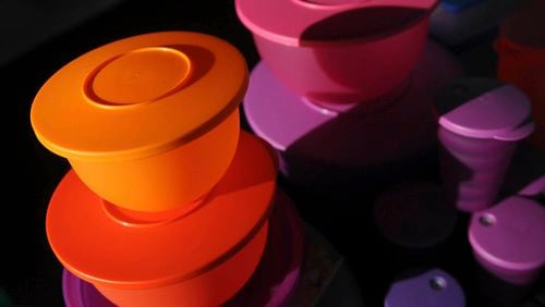 FILE - Colorful Tupperware products are seen in Bellflower, Calif. on Aug. 5, 2011. (AP Photo/Garrett Cheen, File)