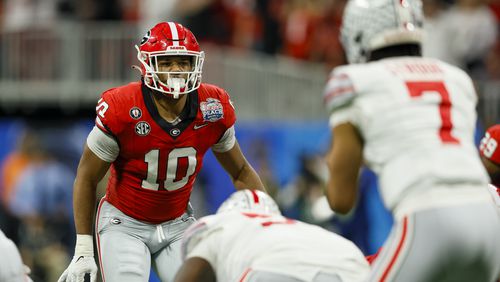 Georgia linebacker Jamon Dumas-Johnson (10) watches Ohio State Buckeyes quarterback C.J. Stroud (7) during the College Football Playoff Semifinal at the Chick-fil-A Peach Bowl In Atlanta on Saturday, Dec. 31, 2022. Georgia won, 42-41. (Jason Getz / Jason.Getz@ajc.com)