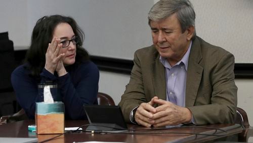 Rose Marie Kosmetatos, left, and her husband, Antonios Pagourtzis, parents of accused Santa Fe High School shooter Dimitrios Pagourtzis, talk before the start of the civil trial against them Friday, Aug. 16, 2024, in Galveston County Court No. 3 Judge Jack Ewing's courtroom at the Galveston County Courthouse in Galveston, Texas. (Jennifer Reynolds/The Galveston County Daily News via AP, Pool)