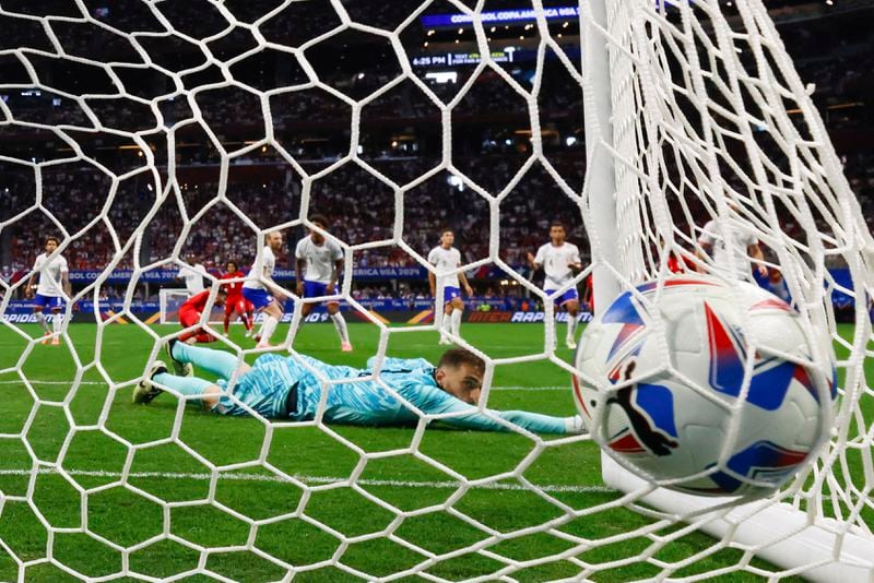 U.S. goalkeeper Matt Turner (1) watches the ball go into the net on a goal by Panama defender César Blackman during the first half of a Copa América 2024 Group C soccer match Thursday, June 27, 2024, in Atlanta. (Miguel Martinez/Atlanta Journal-Constitution via AP)