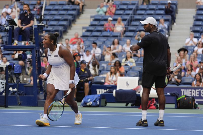 Taylor Townsend, of the United States, and Donald Young, of the United States, react in the first set against Sara Errani, of Italy, and Andrea Vavassori, of Italy, during the mixed doubles final of the U.S. Open tennis championships, Thursday, Sept. 5, 2024, in New York. (AP Photo/Julia Nikhinson)