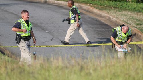 The bizarre series of events began Wed., May 11, 2016, on Cobb Parkway near Bells Ferry Road in Cobb County, where a woman hit and killed a pedestrian, Cobb police Officer Alicia Chilton said. JOHN SPINK / JSPINK@AJC.COM