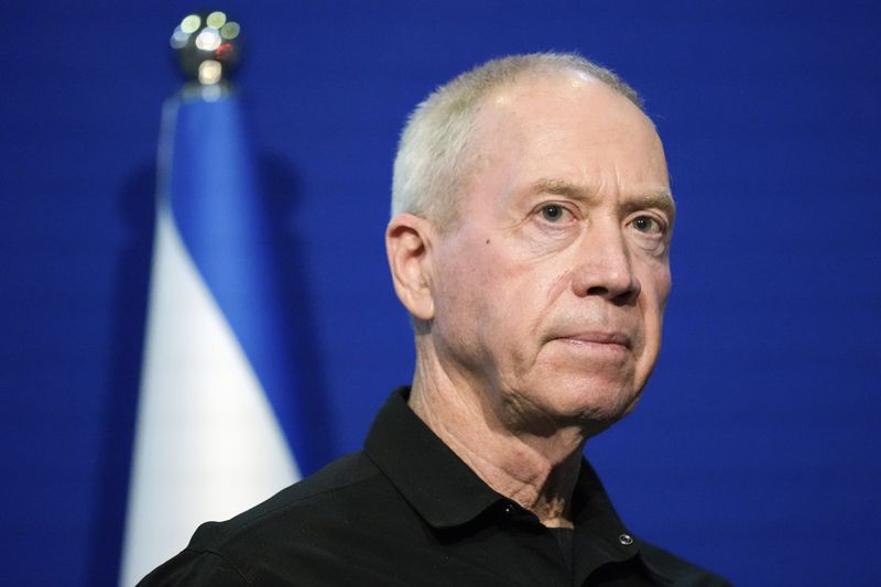 FILE - Israeli Defense Minister Yoav Gallant pauses while making a brief statement to the media at The Kirya, Israel's Ministry of Defense, Monday, Oct. 16, 2023, in Tel Aviv. (AP Photo/Jacquelyn Martin, Pool, File)