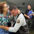 This photo provided by Venice Police Department rescue crews assist residents after conducting door-to-door wellness checks, in coastal areas that were flooded by Hurricane Helene on Friday, Sept. 27, 2024 in Venice, Fla . (Venice Police Department via AP)